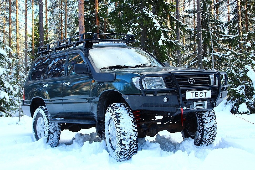 Внедорожная подготовка Toyota land Cruiser 105. Передний силовой бампер TLC 105. Силовые пороги. Экспедиционный багажник.
